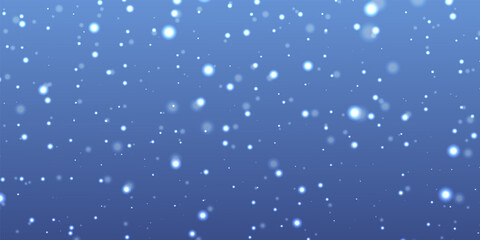 Abstract blue background with falling white bokeh light particles resembling snow or glitter
