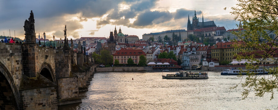 Charles Bridge Prague with Vltava River, Prague Castle panorama view, historic stone bridge with statues, sunset golden hour cityscape Czech Republic - Powered by Adobe
