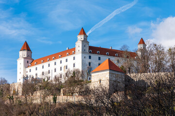 Bratislava Castle on a sunny day, historic landmark overlooking the city. Iconic four-tower fortress on a hill, important cultural and political site in Slovakia.