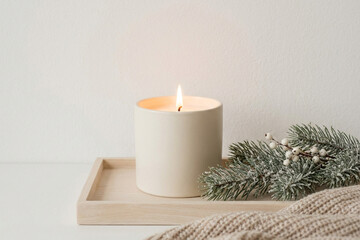 Minimalist Winter Candle Decor on Neutral Background
