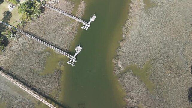 Aerial view of creek marsh with boats and docks in charleston South Carolina