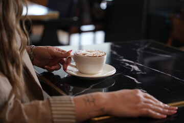 woman drinking coffee in cafe