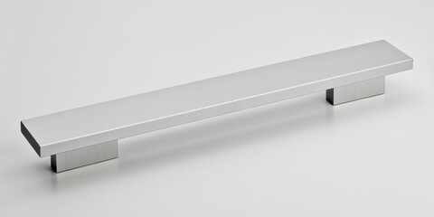 Sleek rectangular brushed aluminum handle with flat top and minimalist base, perfect for modern kitchen cabinetry and furniture.