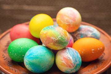 A vibrant collection of painted Easter eggs on a plate