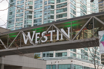 Fototapeta premium covered pedestrian walk with sign at The Westin Harbour Castle, a four-star hotel, located at 1 Harbour Square on Queens Quay W, Toronto