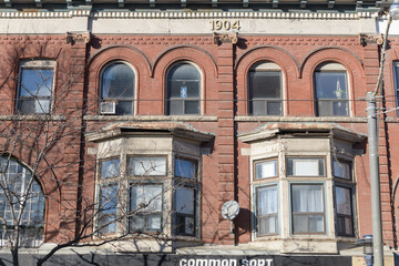Fototapeta premium historic facade and location of Common Sort - Riverside, a clothing store, located at 760 Queen St E, Toronto