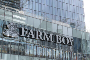 Fototapeta premium exterior building facade and sign of Farm Boy, a supermarket chain, located here at 100 Queen Quay E, at Sugar Wharf Condominiums, Toronto