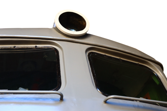 A close-up shot of a train window with a soft light shining through