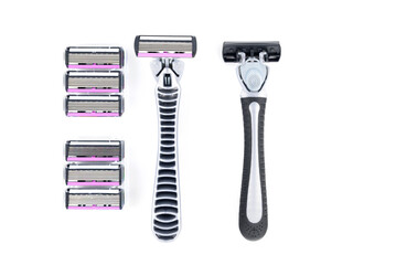 two shavers and a set of replacement cartridges on the left