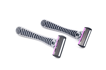 two shaving razors are arranged in parallel