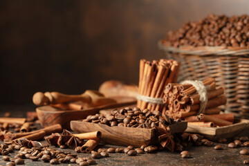 Coffee beans with spices on a brown vintage background.