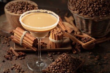 Chocolate martini cocktail or Irish cream liquor on a brown background.