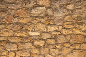 Old stone masonry wall texture

