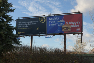 Fototapeta premium traditional roadside billboards on the north side of Lake Shore Blvd E for Betty and DQ, Toronto