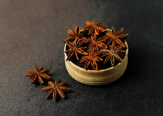 Aromatic Star Anise Pods on Black Stone Surface