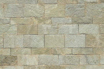 Old rough hewn gray stone wall texture