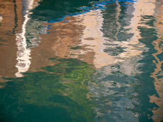 Water, sun, and reflections as abstract artists.