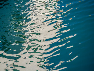 Water, sun, and reflections as abstract artists.