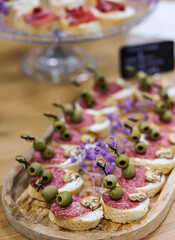 Brie and Plum Crostini on Wooden Serving Board
