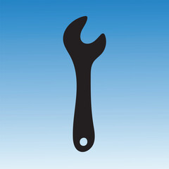 Black wrench silhouette against a blue gradient background, tool for repair