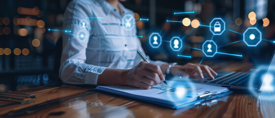 Businesswoman writing notes near laptop with glowing digital icons. Futuristic interface elements symbolize planning, workflow, data management and modern technology in a professional workspace.
