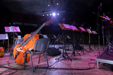 The orchestra's musical instruments are laid out on their workbenches, prepared before the concert.