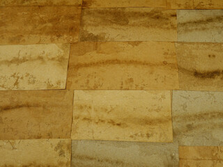 Paper collage of various type of pack paper in brown tones on cardboard. Paper background in a retro style