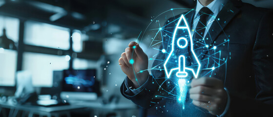 A glowing holographic rocket launch symbolizing a startup concept, displayed above a digital workspace as a person draws and plans innovative business ideas in a futuristic environment.