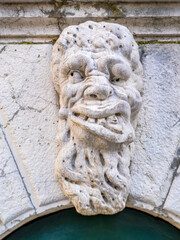 Small figure above a door in Venice.