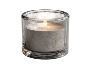 PNG of A lit candle in a glass holder, exuding a warm and calming glow, perfect for a cozy atmosphere.