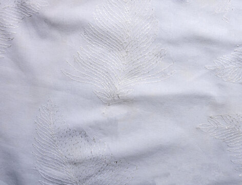 White Indian fabtic with Chikankari Feather Embroidery detail