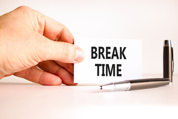 Break time symbol. Concept word Break time on beautiful white card. Beautiful black pen. Beautiful white paper background. Businessman's hand. Business break time concept. Copy space.