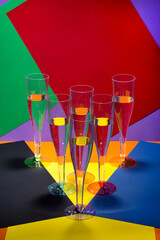 Still life with wine glasses on a colored background