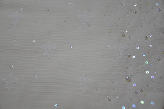 Decorative Fabric with Gradient Effect and Beads Close-Up. Copy Space