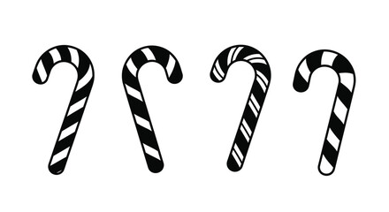 Four black and white striped candy canes in a simple arrangement