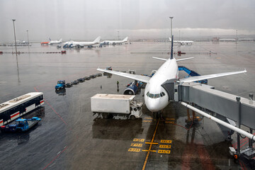 Landed airplane at Barajas airport on a rainy day in Madrid