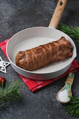 Pan-seared beef tenderloin, tied with kitchen string and ready for roast beef. Roasting beef in the oven, one piece at a time. Merry Christmas.