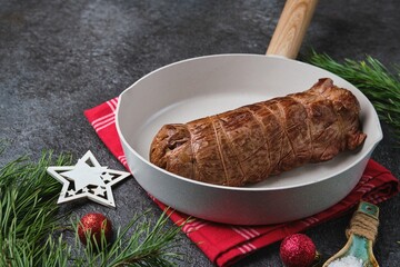 Pan-seared beef tenderloin, tied with kitchen string and ready for roast beef. Roasting beef in the oven, one piece at a time. Merry Christmas.