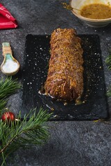 Honey mustard glaze on seared beef tenderloin for roast beef. Roasting beef whole in the oven. Merry Christmas.