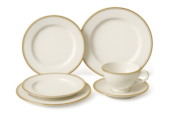 Elegant porcelain dinnerware set with gold rims isolated on a transparent background