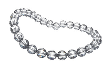 Obraz premium A beautiful strand of clear, faceted crystal beads arranged in a gentle curve, perfect for jewelry making and crafting projects. background removed