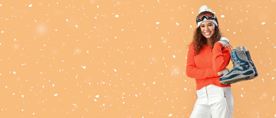 Female snowboarder on color background