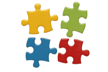 Obraz premium Four vibrant, glossy puzzle pieces in yellow, green, blue, and red, arranged separately, symbolizing solutions, teamwork, or completion. background removed
