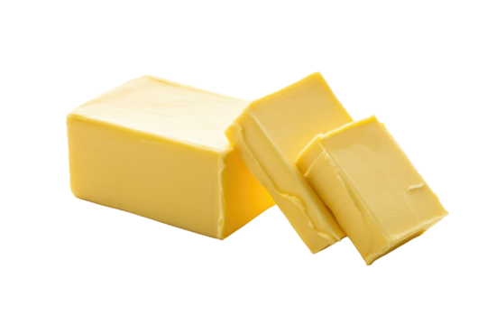 A solid block of yellow butter with two smaller sliced pieces, ready for cooking or baking. background removed