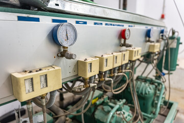 Clocks and control mechanisms for the operation of industrial refrigeration installation for refrigerated warehouses.