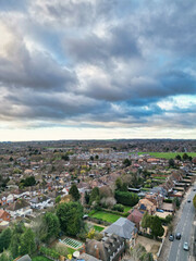 Obraz premium Aerial Drone Camera View of British Residential Buildings and Roads with Traffic of East Luton City Streets Aerial View of England During Evening of Winter. 25th November, 2025