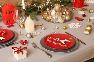 Festive table setting with beautiful Christmas decorations, closeup