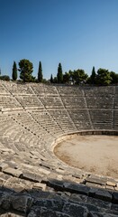 Impressive ancient outdoor stone theater with curved seating tiers reaching toward the sky, showcasing magnificent historical architecture ,heritage, landscape, ancient