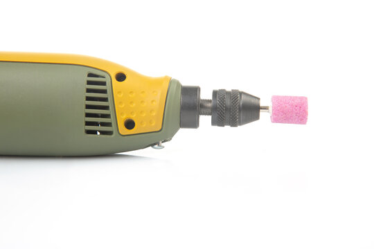 graver and drilling electric tool on a white background. dremel for processing materials and repairing parts