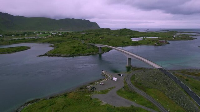 Drone  flying backwards revealing the stunning landscape surrounding the fredvang bridges in lofoten, norway. 4k resolution footage